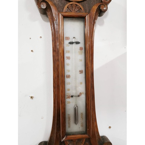 148 - Vintage oak well carved banjo barometer, screen is cracked, has a cased mercury thermometer to the t... 