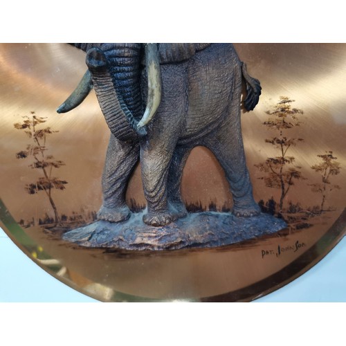 166 - Copper effect circular picture dipicting a 3D elephant with protruding tusks, signed to the bottom r... 