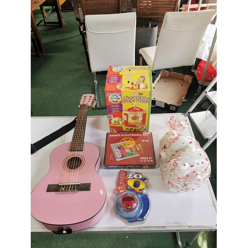 105 - Childs Lauren guitar with a junior chocolate shake maker a smart electronic kit w/35 and an I can re... 