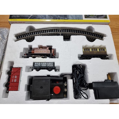 191 - A boxed as new Hornby R1035 The Rambler electric train set OO gauge, complete with track mat, paper ... 