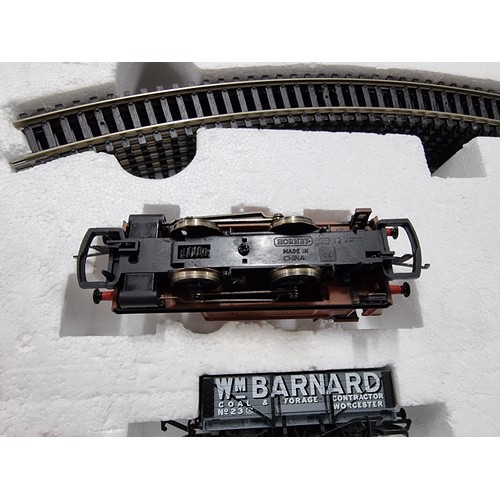 191 - A boxed as new Hornby R1035 The Rambler electric train set OO gauge, complete with track mat, paper ... 