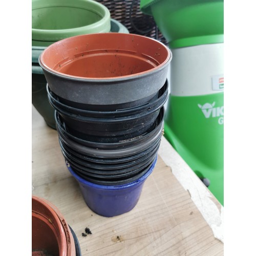 57 - Large collection of plastic planters of varying sizes all in good order, largest one measures 70cm d... 