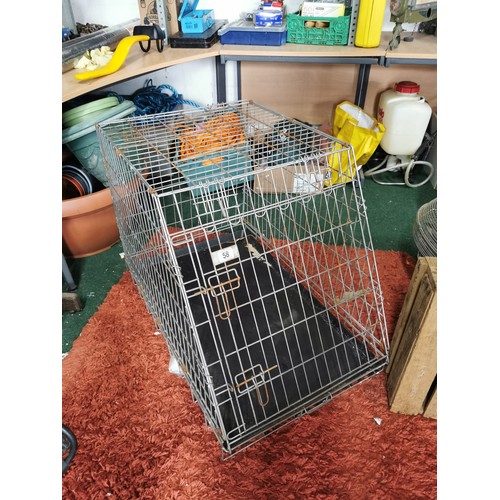 58 - Large metal dog cage in good order base size 90cm by 58cm