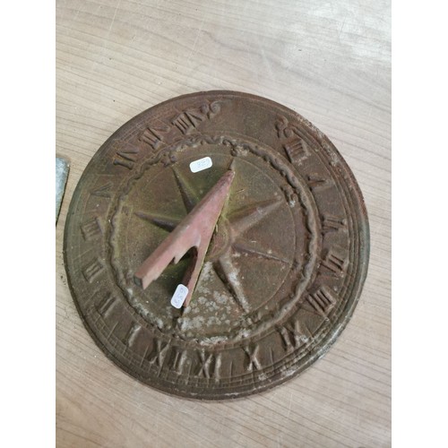 61 - Collection of lead sheets folded up along with a brass sundial, sundial has a diameter of  28cm