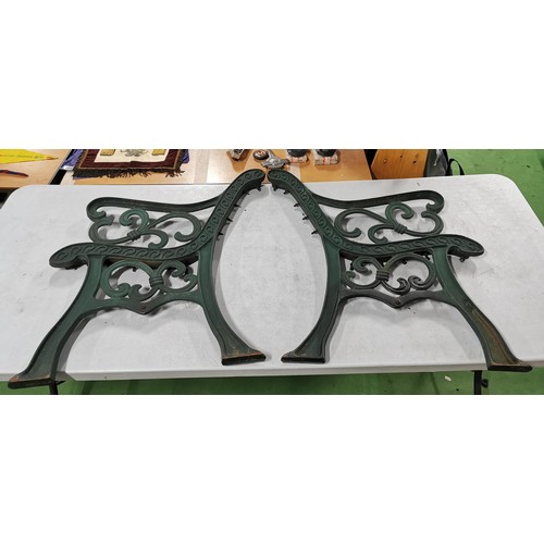 425 - Pair of green painted cast iron bench ends in good order