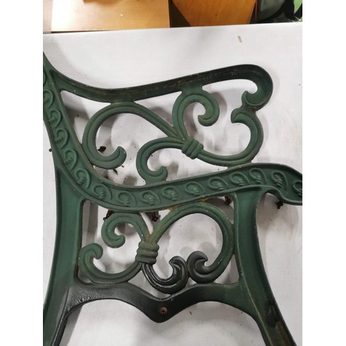 425 - Pair of green painted cast iron bench ends in good order