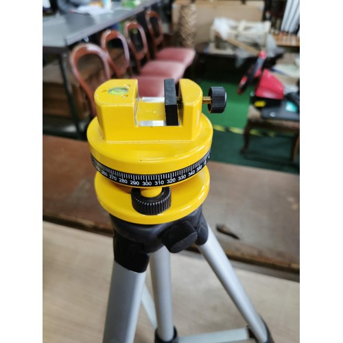 26 - Cased working laser level kit with instructions and spirit level and its tripod