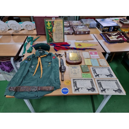 203 - A large collection of boys scout and girl guides items to include a vintage British scouts uniform c... 