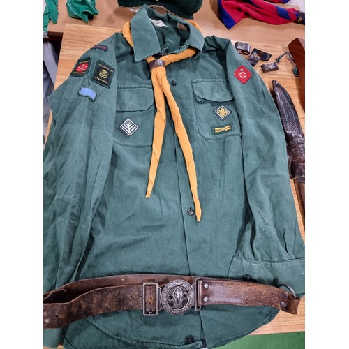 203 - A large collection of boys scout and girl guides items to include a vintage British scouts uniform c... 