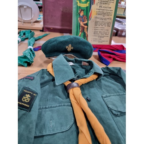 203 - A large collection of boys scout and girl guides items to include a vintage British scouts uniform c... 