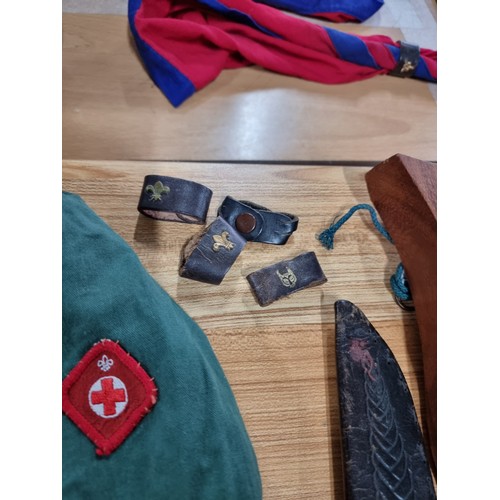 203 - A large collection of boys scout and girl guides items to include a vintage British scouts uniform c... 