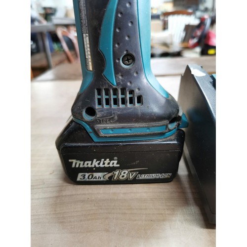 41 - Makita battery angle grinder with charger and a Makita 18v rechargeable drill