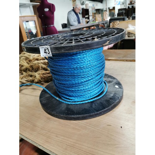 43 - Reel of blue nylon rope and a section of rope