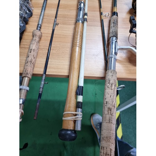 208 - A large quantity of various fishing rods and 2 fishing reels fitted in a good quality fishing rod ba... 