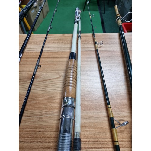 208 - A large quantity of various fishing rods and 2 fishing reels fitted in a good quality fishing rod ba... 