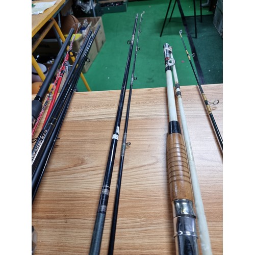 208 - A large quantity of various fishing rods and 2 fishing reels fitted in a good quality fishing rod ba... 