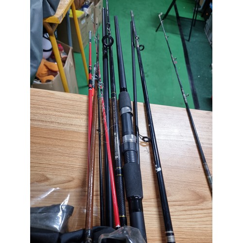 208 - A large quantity of various fishing rods and 2 fishing reels fitted in a good quality fishing rod ba... 