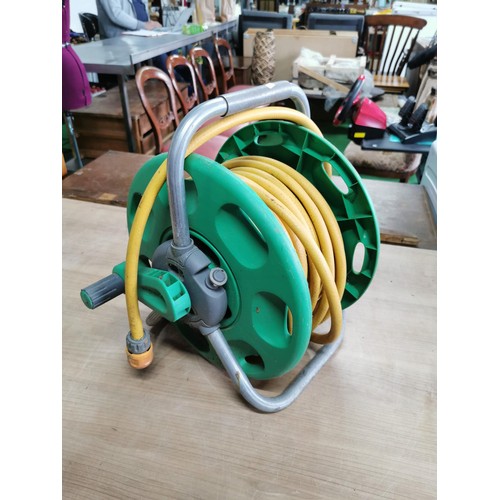 49 - Hozelock hose reel complete with its hose