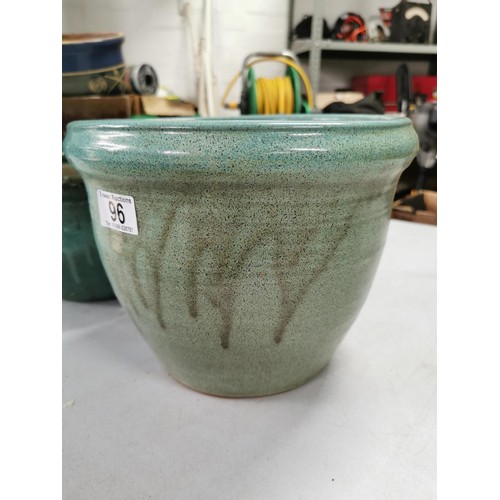 96 - 2x glazed stoneware planters in very good order largest measures 29cm high 36cm diameter