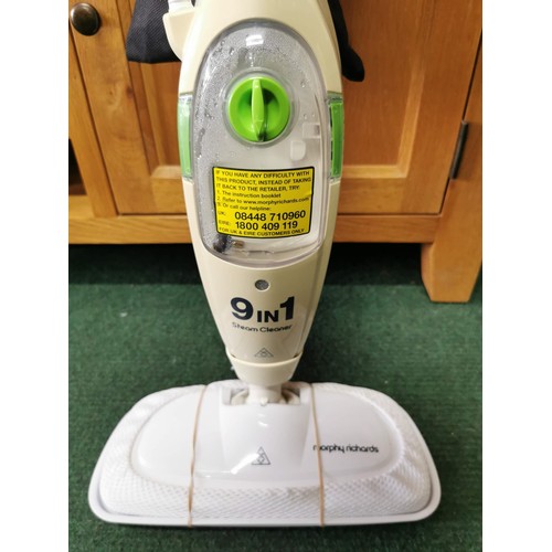 106 - Morphy Richards 9 in 1 Steam Cleaner in good condition complete with accessories