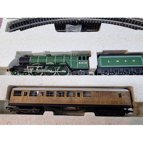 7 - A boxed as new R1001 Hornby Flying Scotsman train set complete, along with a super rare large paper ... 