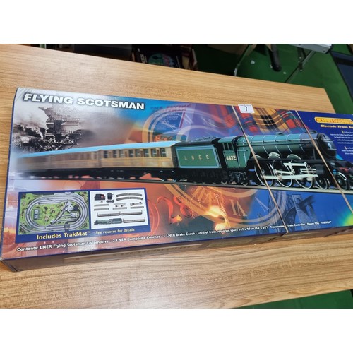 7 - A boxed as new R1001 Hornby Flying Scotsman train set complete, along with a super rare large paper ... 