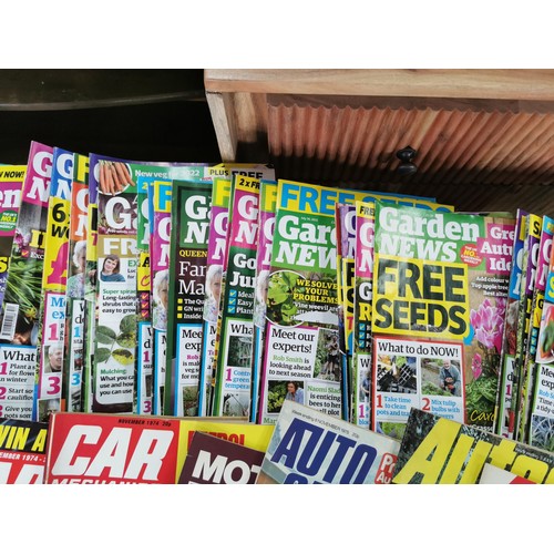 127 - A quantity of car and bike related magazines including Autocar, popular motoring, along with a quant... 