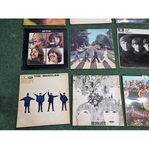 26 - A large collection of 16x vintage LP vinyl records all relating to The Beatles. To include 12 offici... 