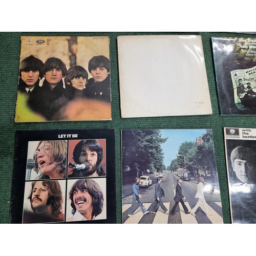 26 - A large collection of 16x vintage LP vinyl records all relating to The Beatles. To include 12 offici... 