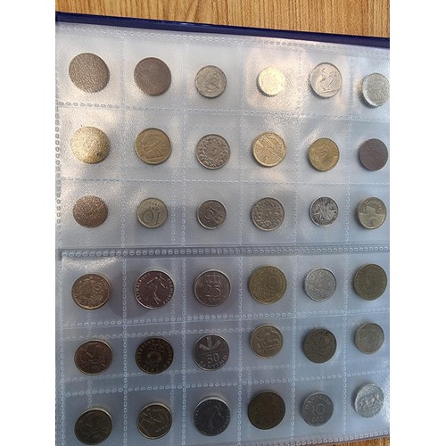 29 - A comprehensive coin album full of various world coins along with an as new handy fold flat fabricat... 