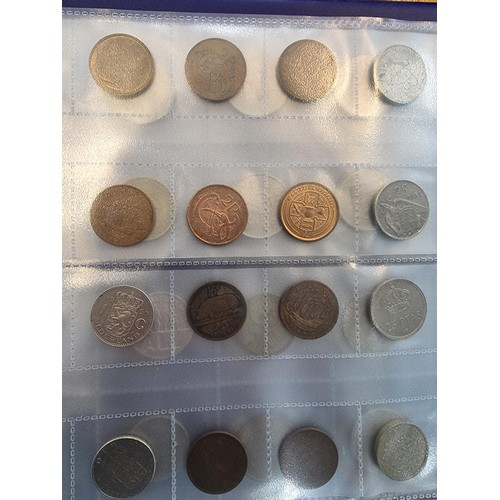 29 - A comprehensive coin album full of various world coins along with an as new handy fold flat fabricat... 