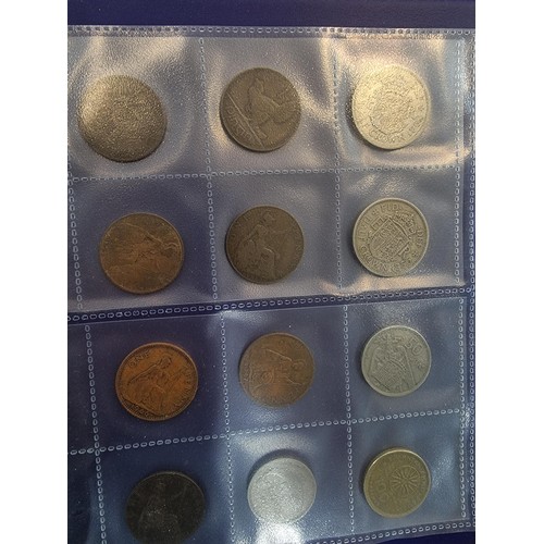 29 - A comprehensive coin album full of various world coins along with an as new handy fold flat fabricat... 