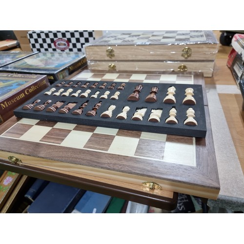 34 - 3x new and sealed wooden chess sets. 39cm2, one has been unpackaged for display.