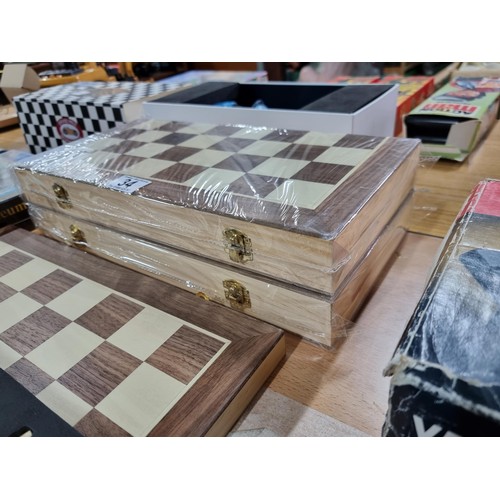 34 - 3x new and sealed wooden chess sets. 39cm2, one has been unpackaged for display.