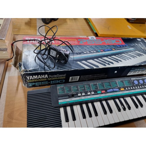 35 - A boxed Yamaha Portasound PSS-190 portable mini keyboard, battery powered. includes PSU but works on... 