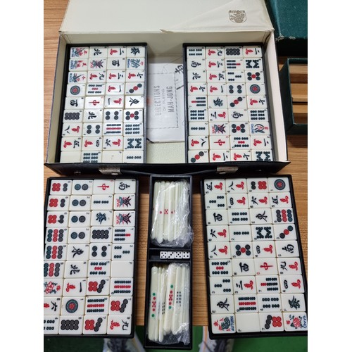 50 - A good quality complete Mahjongg game set by dragon, comes along with a boxed set of wracks for Mahj... 