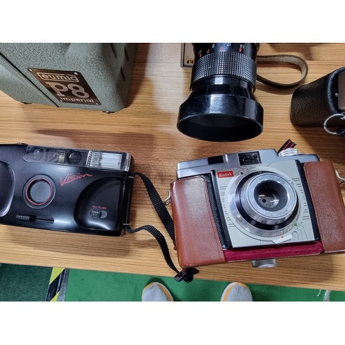 52 - A large quantity of various vintage cameras to include a Chinonflex TTL camera with a Reflecta 55mm ... 