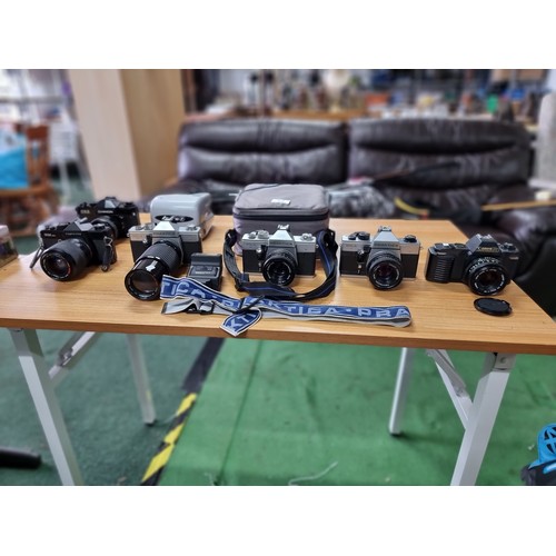 53 - A large collection of 6 various vintage 35mm cameras plus a Polaroid camera. All in full working ord... 