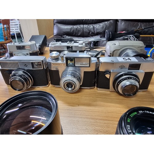 54 - A large collection of 12 various vintage cameras to include rangefinder cameras along with a large q... 