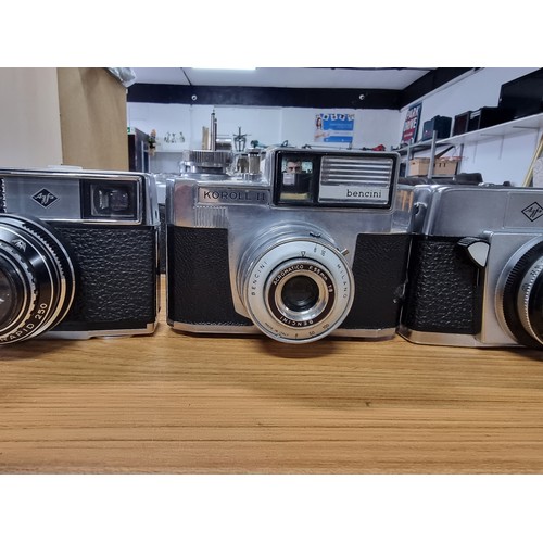 54 - A large collection of 12 various vintage cameras to include rangefinder cameras along with a large q... 