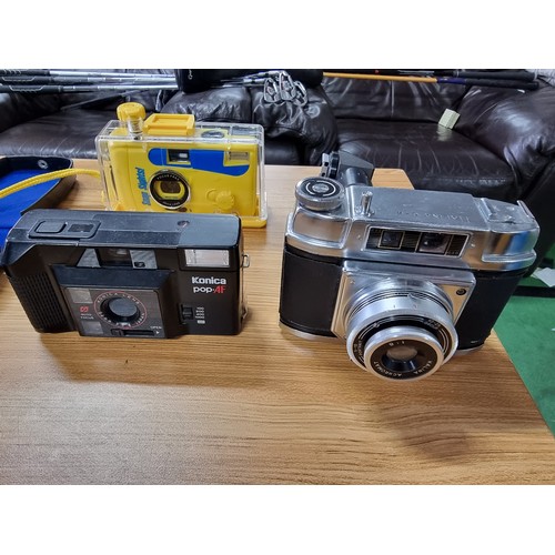 54 - A large collection of 12 various vintage cameras to include rangefinder cameras along with a large q... 