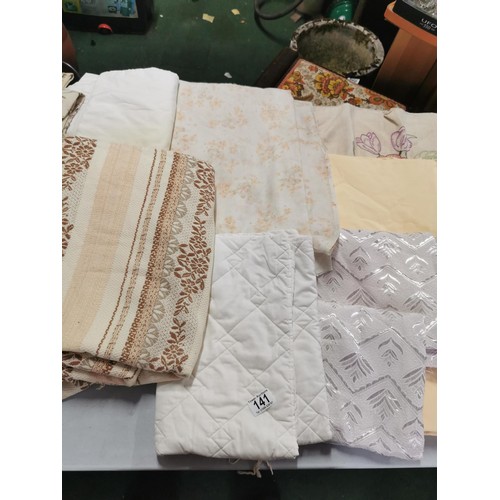 141 - Large quantity of material inc curtains, single bed sheets, eiderdowns etc in good order