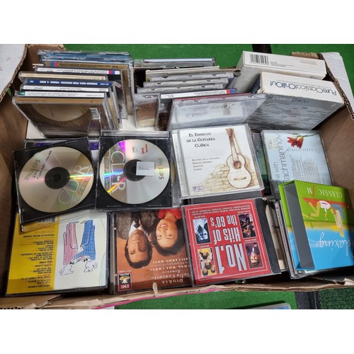 61 - A box full of various books and a box full of various cd's.