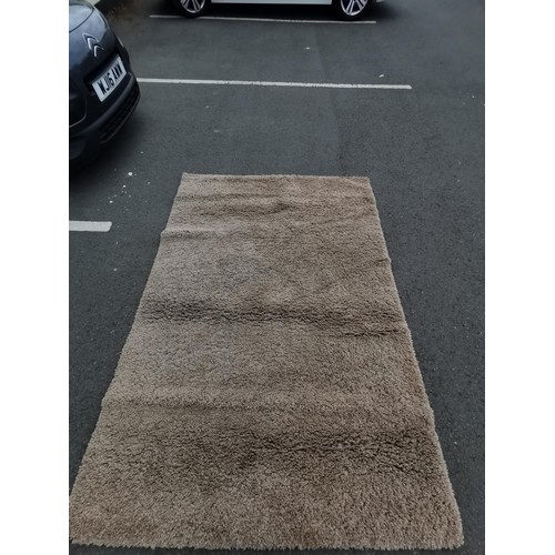 164 - Dunelm  biscuit colored rug in good order deep pile measure 160 cm x 230xm