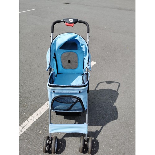 169 - Pale blue foldable dog / cat pram, in good order folds flat for ease of storage