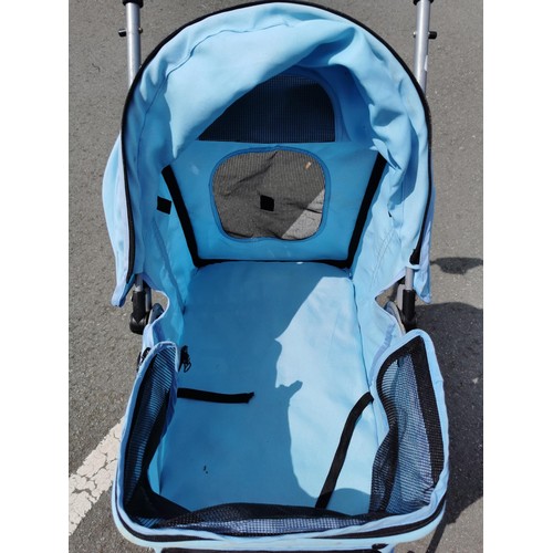 169 - Pale blue foldable dog / cat pram, in good order folds flat for ease of storage