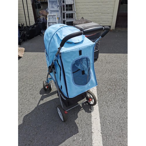 169 - Pale blue foldable dog / cat pram, in good order folds flat for ease of storage