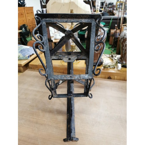 176 - Vintage wrought iron decorative wall corner light with scrolling to the edges in good order, require... 