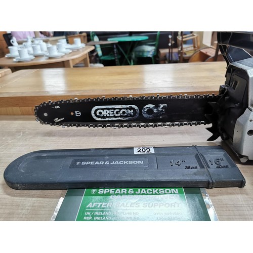 209 - Spear and Jackson petrol chainsaw in good working condition with paperwork