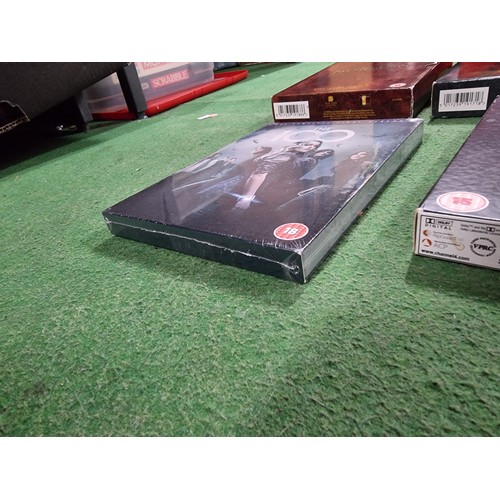 77 - A quantity of DVD's including many DVD box sets, including The Lord of the Rings, Gladiator, Merlin,... 